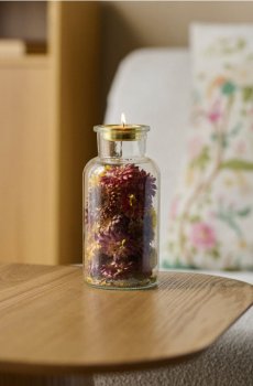 Скляний декоративний свічник із сухоцвітами у формі пляшки - різнобарвний