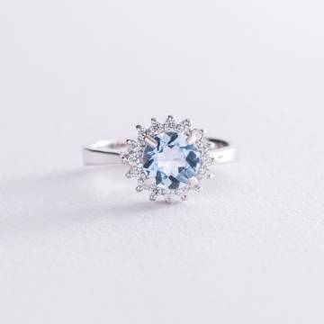 Серебряное кольцо с голубым топазом и фианитами 111056 Серебряное кольцо с голубым топазом и фианитами 111056