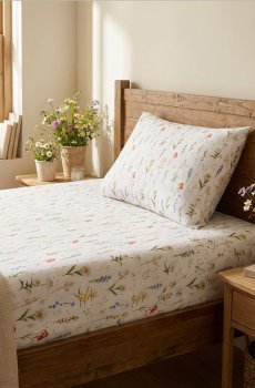 Бавовняне простирадло на гумці з квітами - різнобарвний