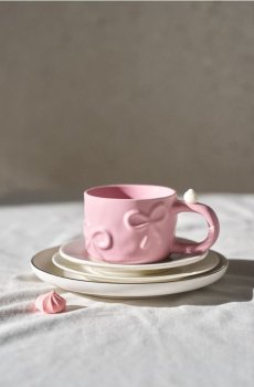 Керамічне горнятко з візерунком бантиків - кремовий