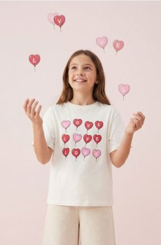 Бавовняна oversize футболка з принтом - кремовий