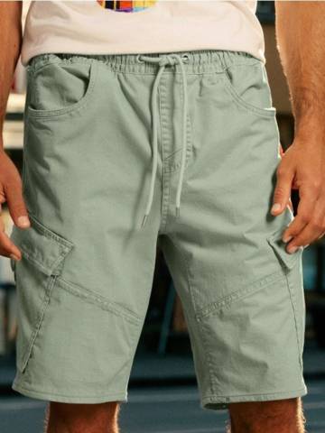 Джинсові шорти з потертостями - блідо-зелений