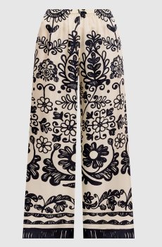 Бежевые брюки из шелка в принт