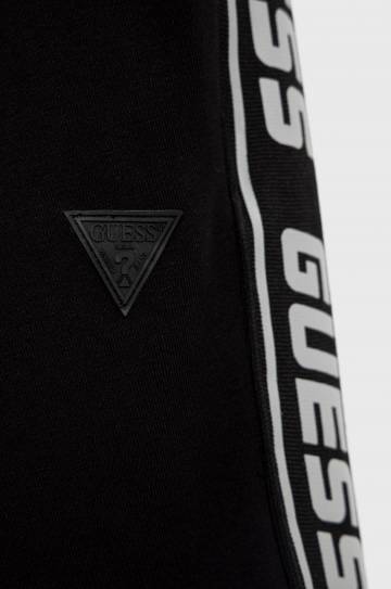 Детские спортивные штаны Guess цвет чёрный с аппликацией Детские спортивные штаны Guess цвет чёрный с аппликацией