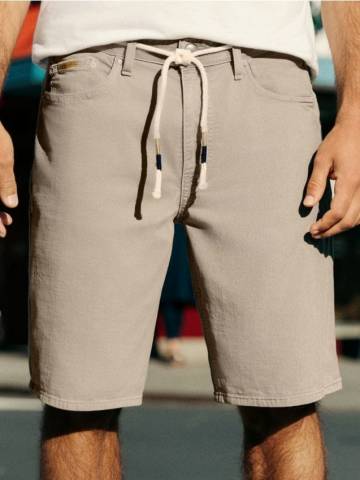 Джинсові шорти з потертостями - лаймовий