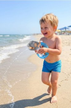 Іграшка – Водяний пістолет у формі дельфіна на батарейках - різнобарвний
