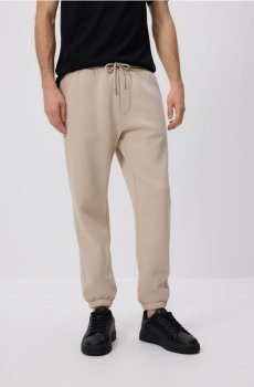 Reserved - Спортивні штани regular fit - бежевий - 167EF-08X