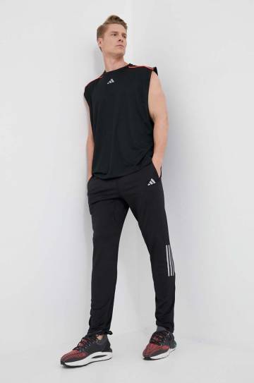 Штаны для бега adidas Performance Own the Run цвет чёрный с принтом Штаны для бега adidas Performance Own the Run цвет чёрный с принтом