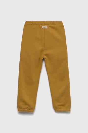 Детские хлопковые штаны United Colors of Benetton цвет жёлтый однотонные Детские хлопковые штаны United Colors of Benetton цвет жёлтый однотонные