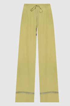 Зеленые брюки с ажурной вышивкой