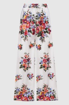 Белые брюки из шелка в принт