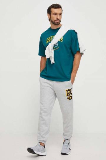 Хлопковые спортивные штаны Puma PUMA X STAPLE цвет серый с аппликацией Хлопковые спортивные штаны Puma PUMA X STAPLE цвет серый с аппликацией