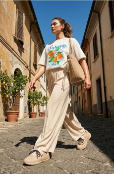 Бавовняна oversize футболка з принтом - кремовий