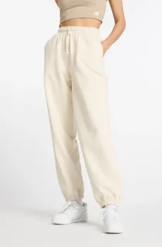 Женские бежевые спортивные брюки NB Athletics Бежевый 35-38 New Balance WP41513LIN