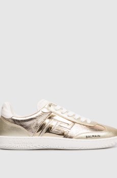 Золотые кроссовки с логотипом