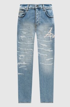 Голубые джинсы с прорехами