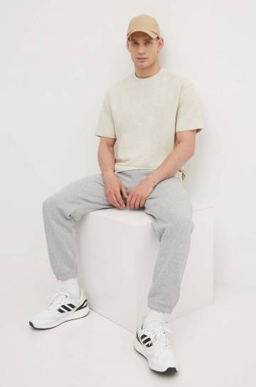Хлопковая футболка Puma мужской цвет бежевый однотонный Хлопковая футболка Puma мужской цвет бежевый однотонный